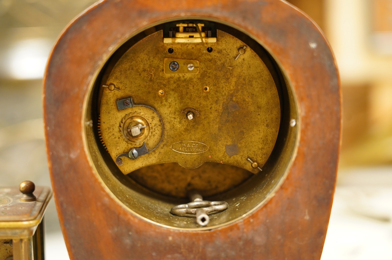 Two carriage clock, an Edwardian mantel clock, 25cm high, and a watch mounted in an oak case (4). Condition - fair, not tested for working